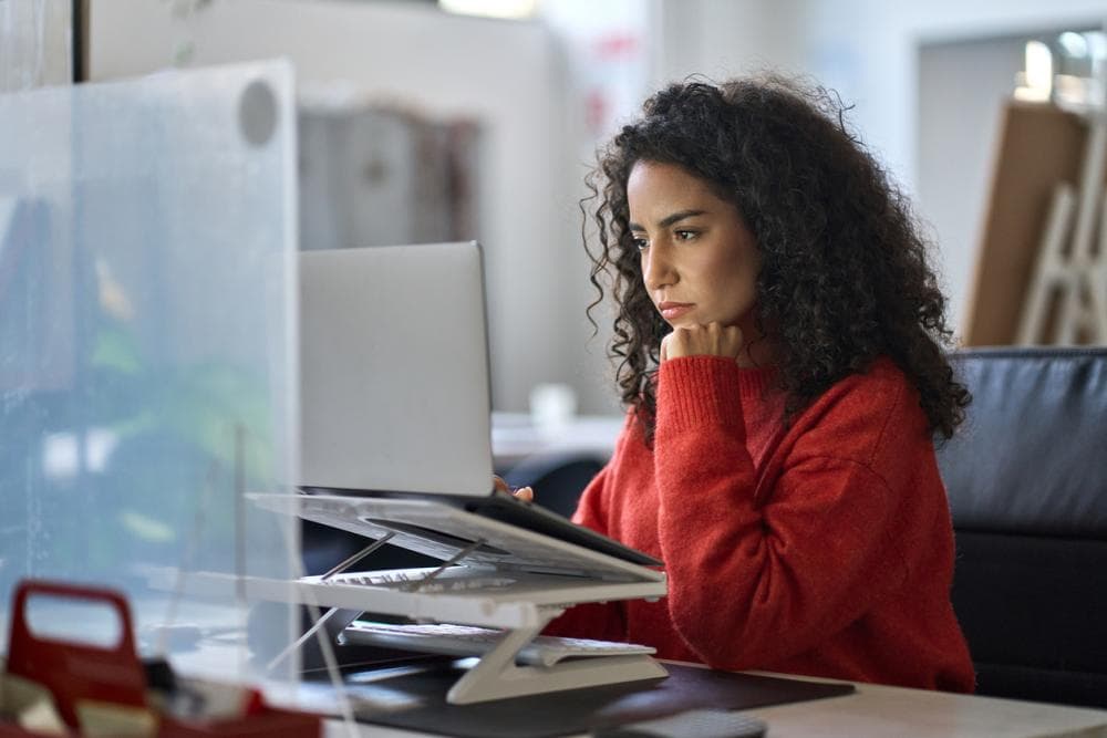 woman researching on laptop