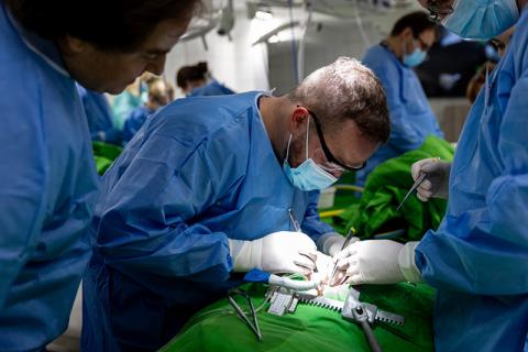 Doctors performing heart surgery